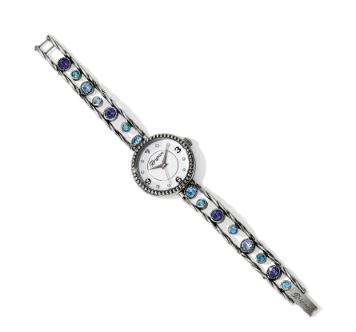 Collection: Halo Color: Silver-Tanzanite Closure: Fold-over clasp Length: 6 1/4" - 8" Adjustable Face Diameter: 1 1/8" Material: Swarovski crystal Finish: Silver plated
